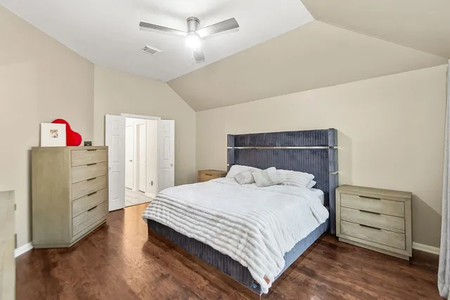 a bedroom with a bed and a dresser