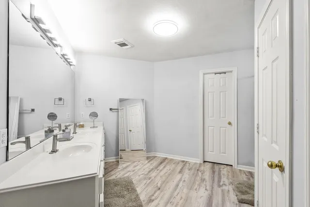 a bathroom with a sink and a mirror