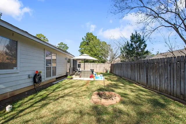 a view of a backyard with a sitting area