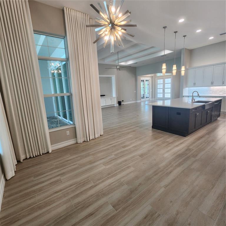 512 Blue Shell Loop Sarasota, FL 34240 - Photo 7 of 44 an open space with wooden floor and a window