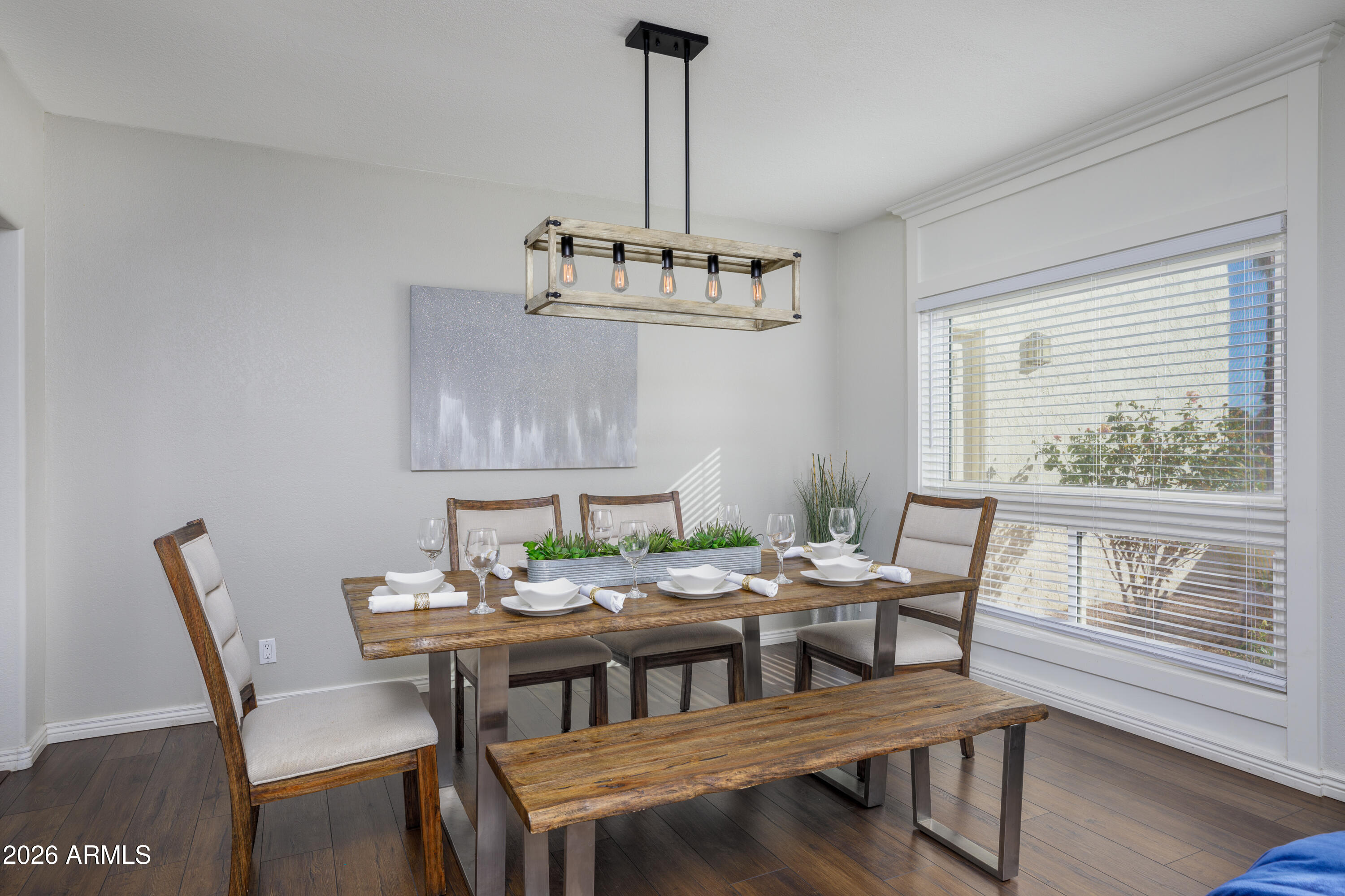 6932 East Presidio Road Scottsdale, AZ 85254 - Photo 13 of 30 a view of a dining room with furniture window and wooden floor