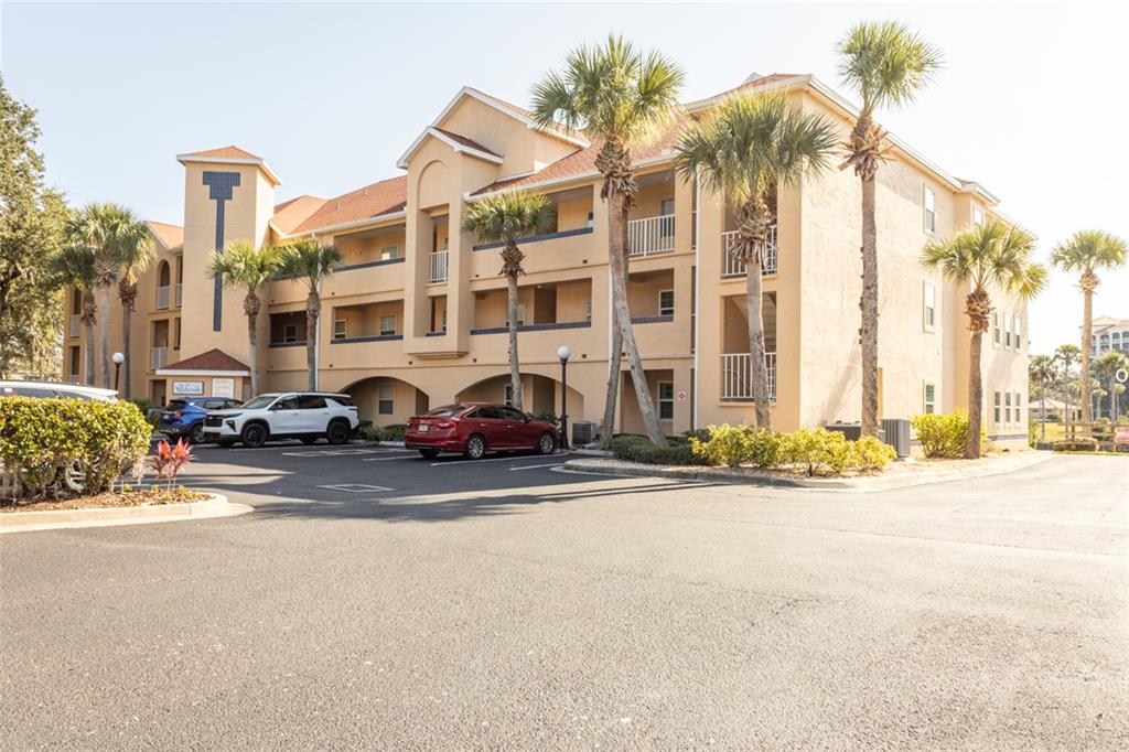 a view of a street with a building in the background