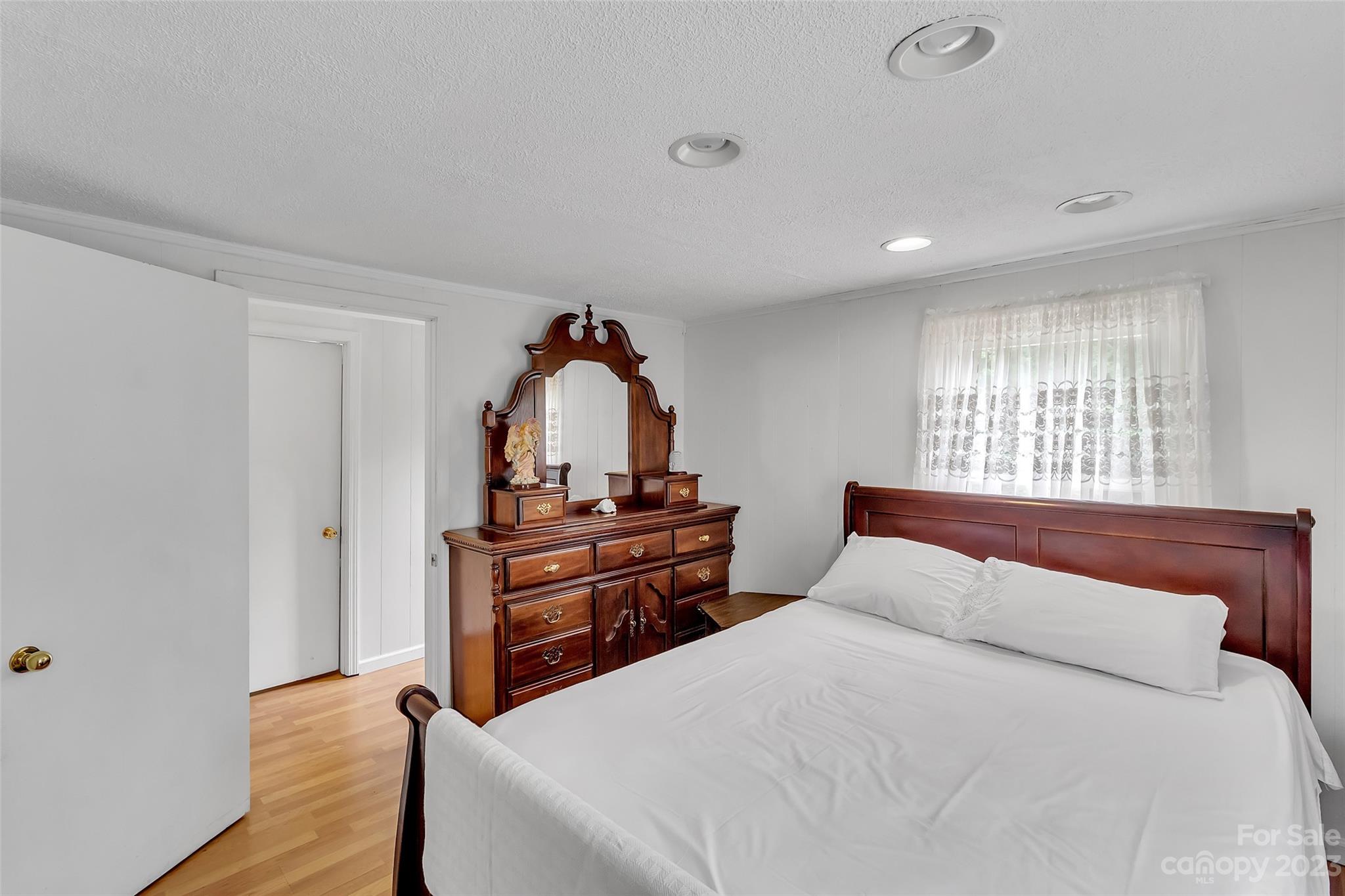 9 Alzena Road Sylva, NC 28779 - Photo 11 of 25 a bedroom with a bed and a dresser