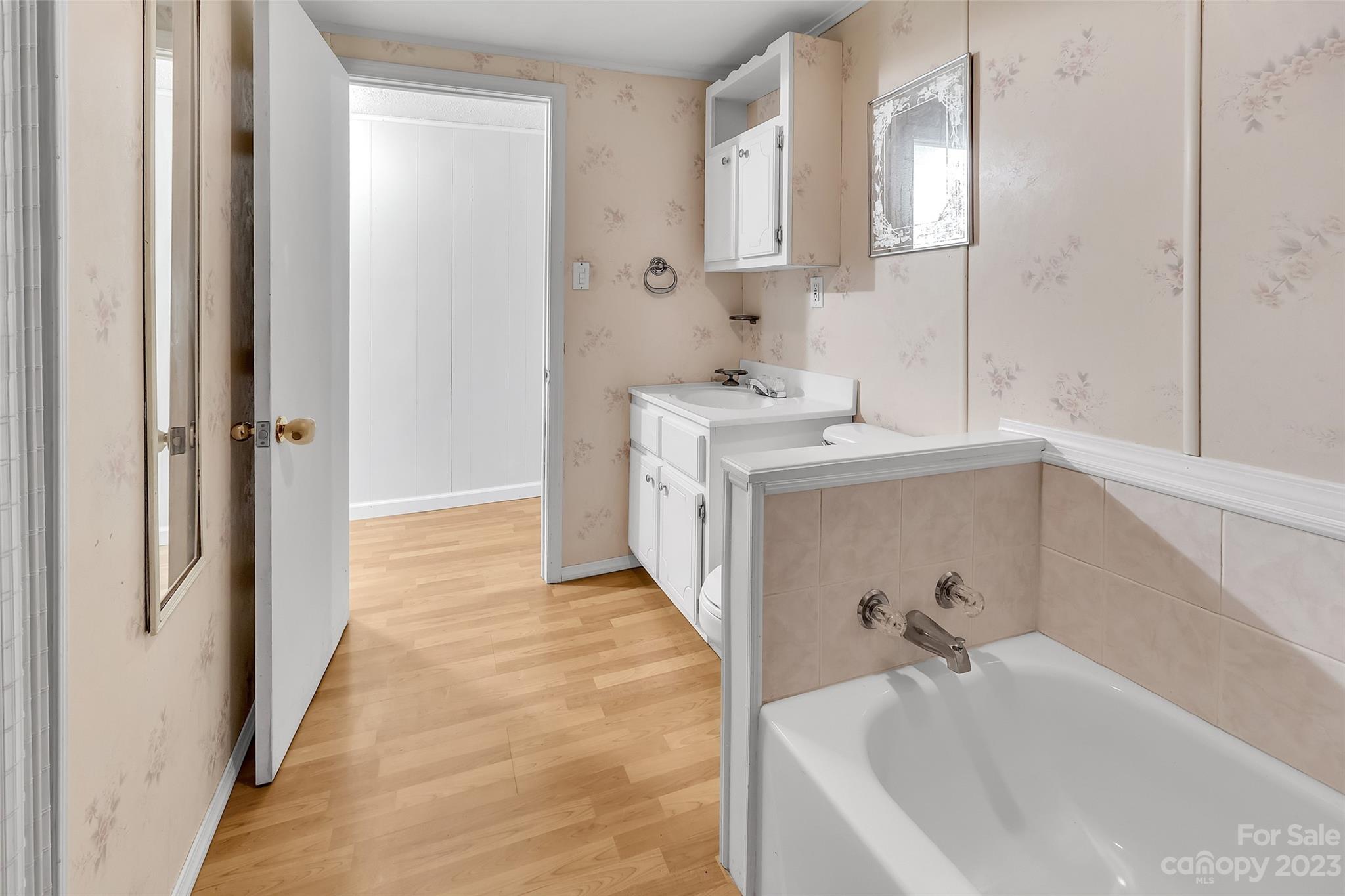 9 Alzena Road Sylva, NC 28779 - Photo 17 of 25 a bathroom with a tub sink and mirror