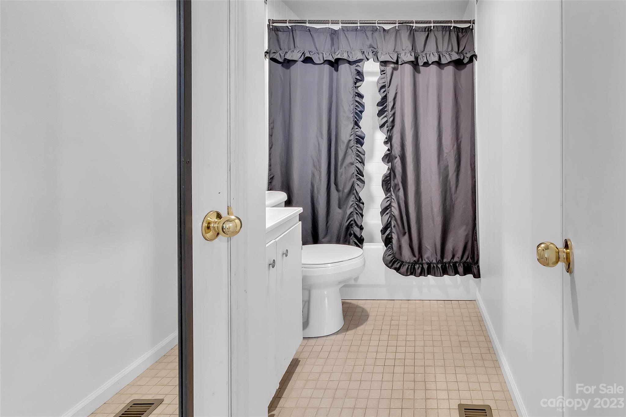 9 Alzena Road Sylva, NC 28779 - Photo 19 of 25 a bathroom with a toilet and a shower