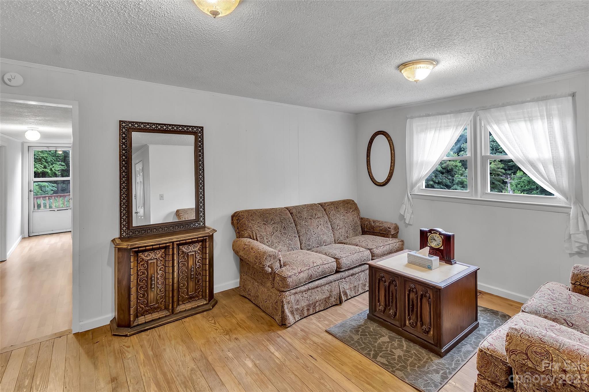 9 Alzena Road Sylva, NC 28779 - Photo 9 of 25 a living room with furniture and a large window