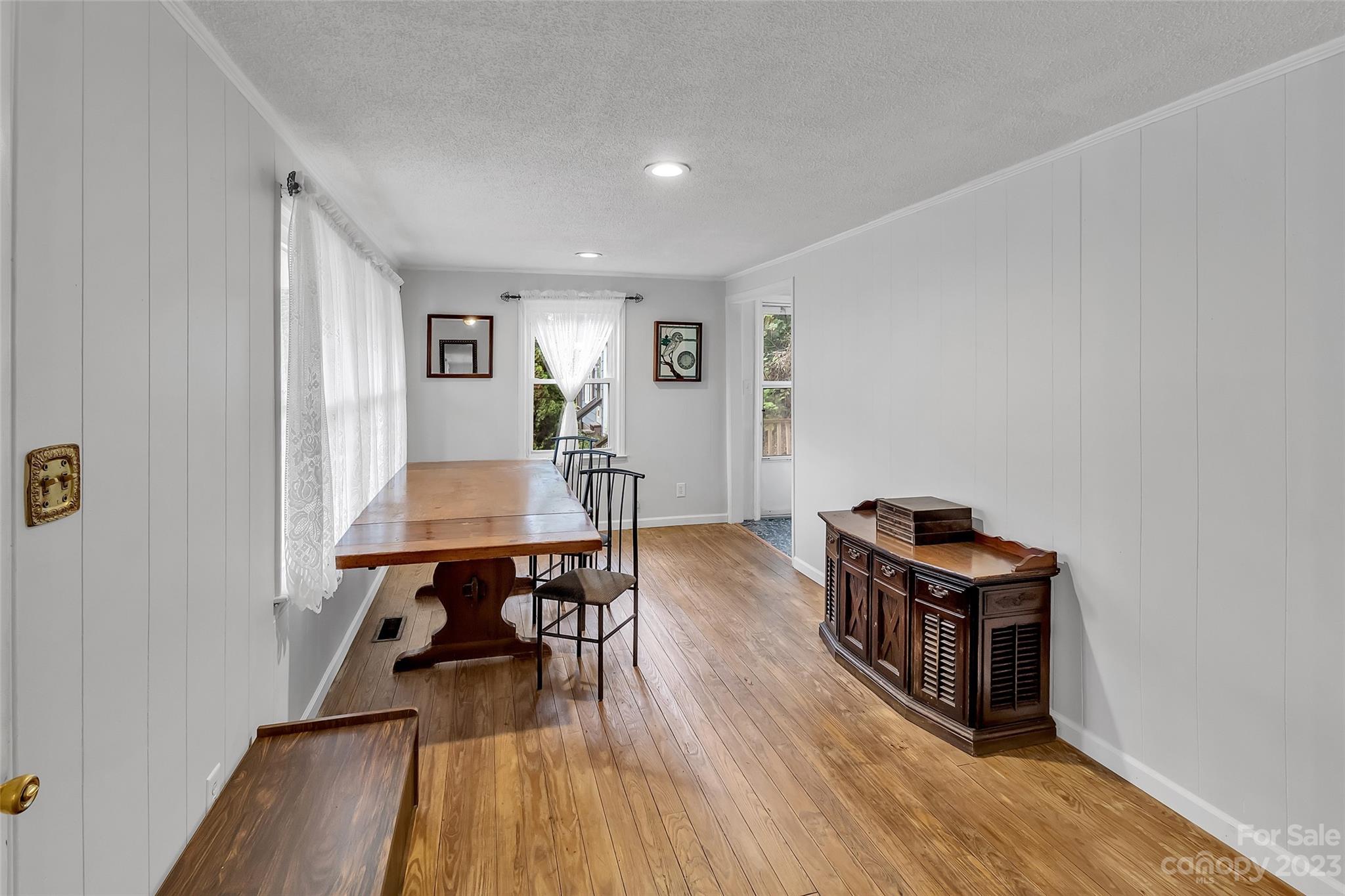 9 Alzena Road Sylva, NC 28779 - Photo 10 of 25 a living room with furniture and a wooden floor