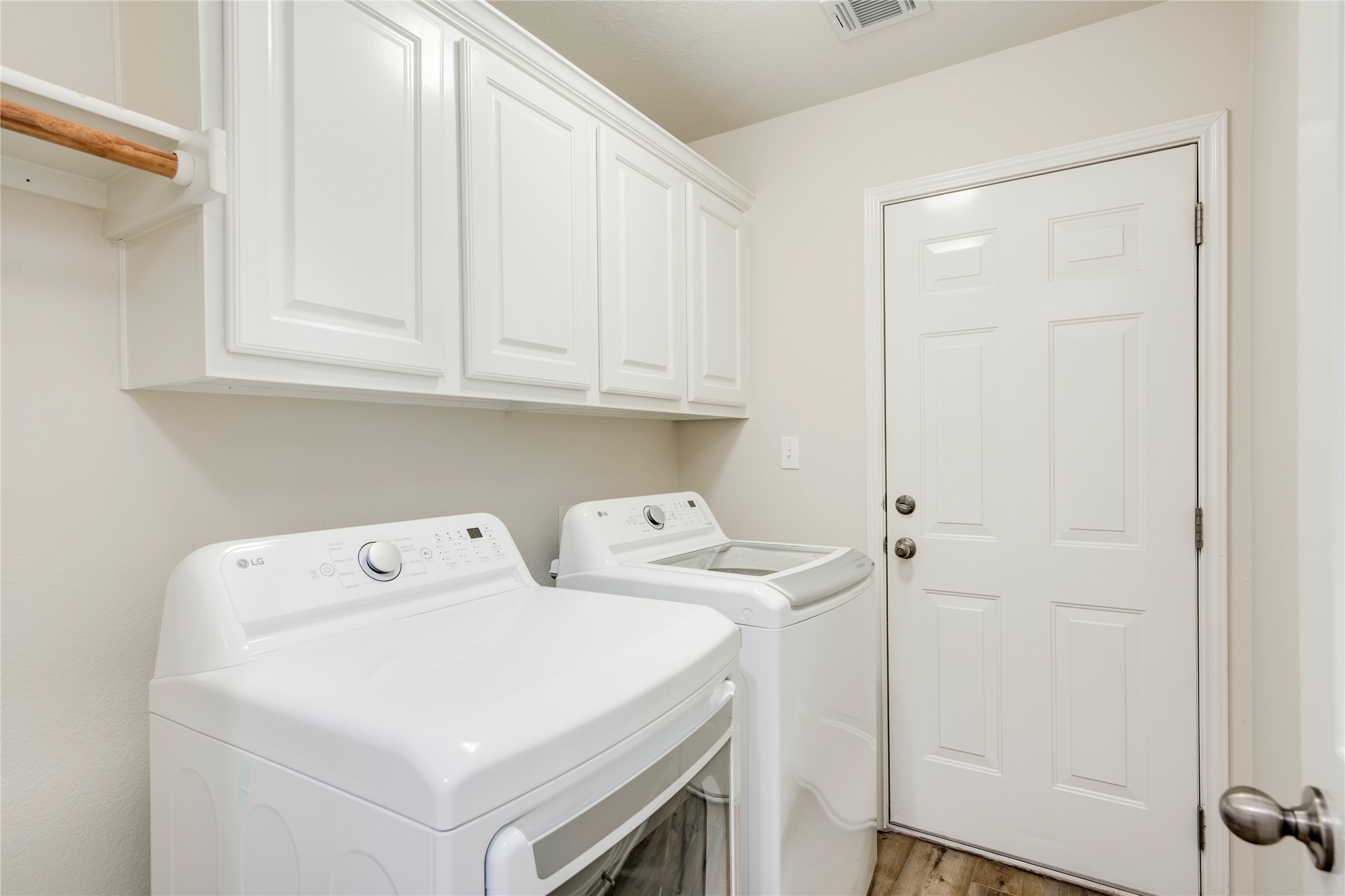 1813 Nelson Ranch Loop Cedar Park, TX 78613 - Photo 24 of 39 A dedicated laundry space offers convenient storage solutions and modern appliances for daily chores.