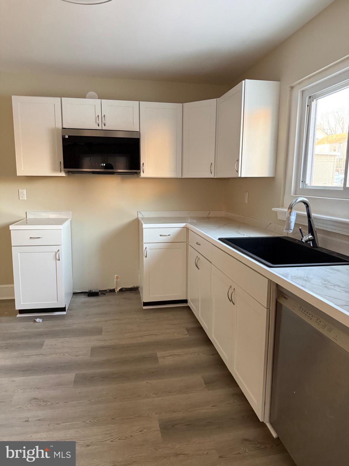 306 North Kelly Street Culpeper, VA 22701 - Photo 4 of 9 Modern kitchen with sleek cabinetry.