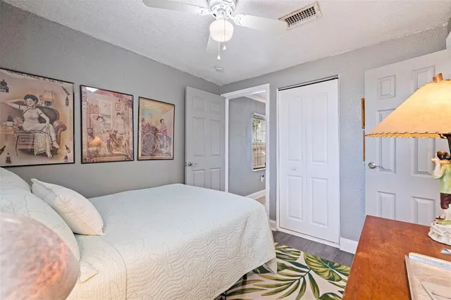 an aerial view of a house with a yard basket ball court and outdoor seating