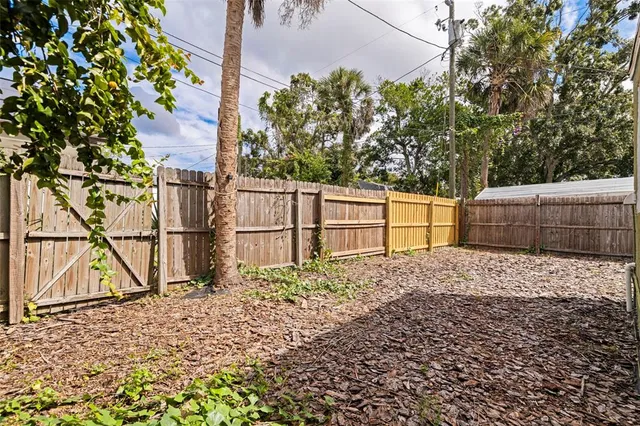 a backyard of a house with lots of green space