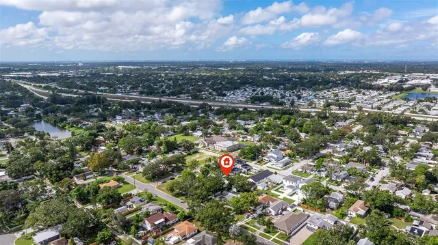 an aerial view of residential building and trees