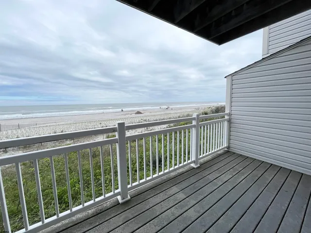 a view of balcony with wooden floor