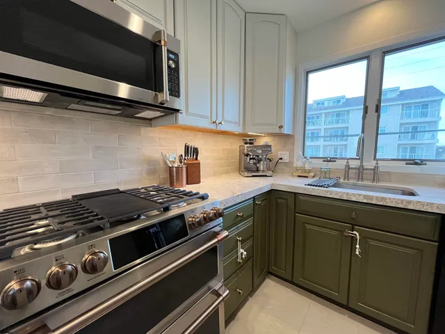 a kitchen with a stove and a sink