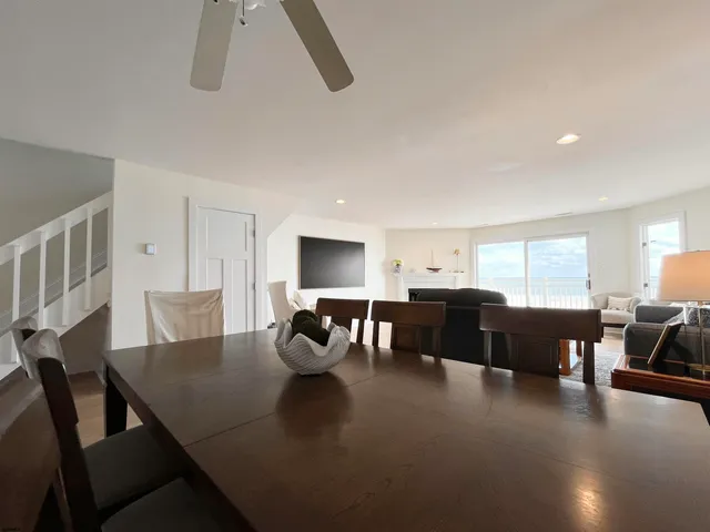 a view of a dining room with furniture and window