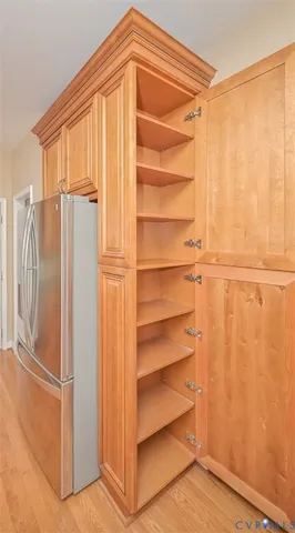 a view of walk in closet with empty racks