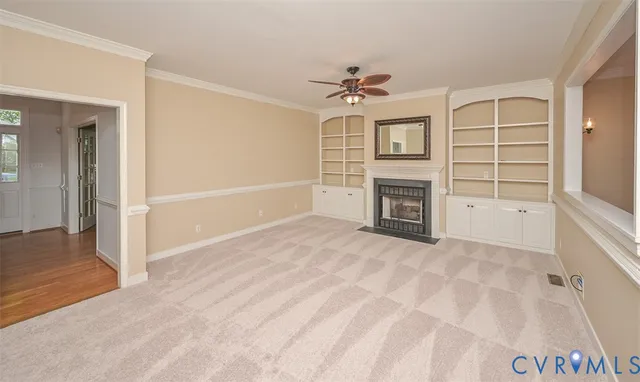 a view of empty room with a fireplace