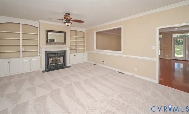 a view of empty room with a fireplace