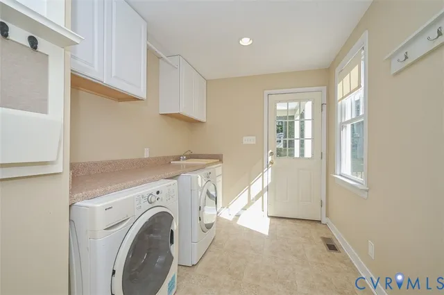 a view of a kitchen with washer and dryer