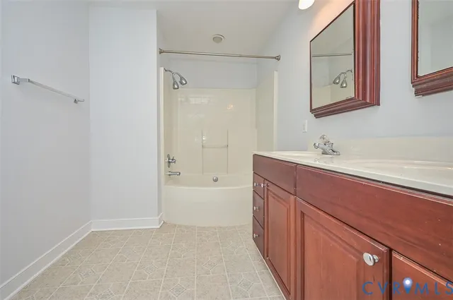 a bathroom with a sink a mirror and a bathtub