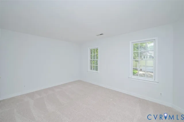 an empty room with windows