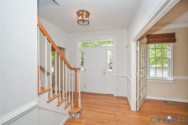 a view of an entryway with wooden floor
