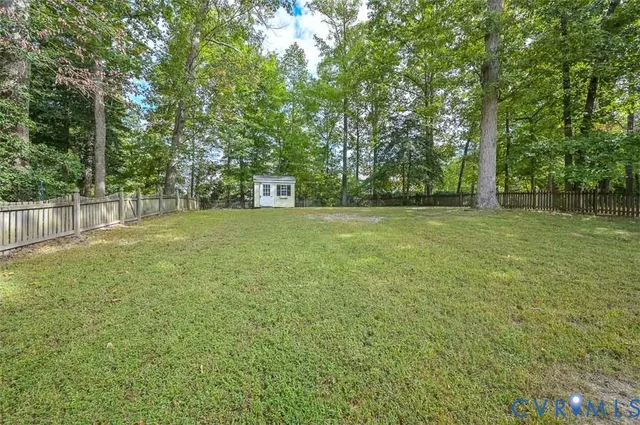 a view of a field with trees in front of it