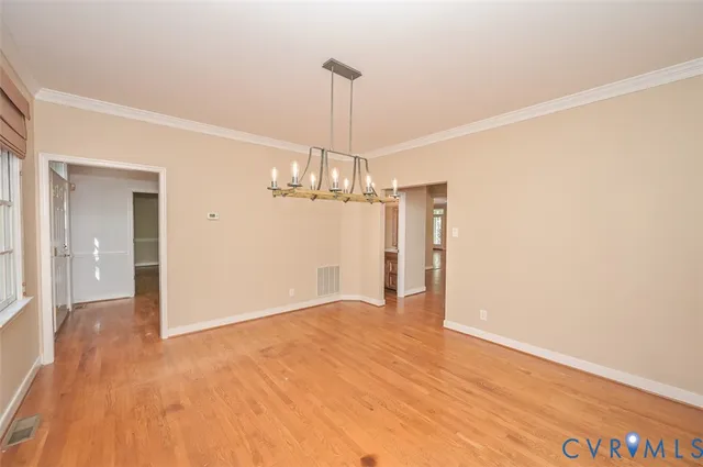 a view of a chandelier in an empty room