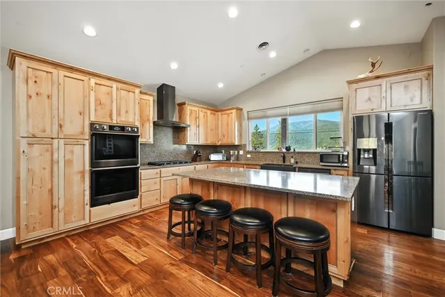 a large kitchen with a table and chairs in it