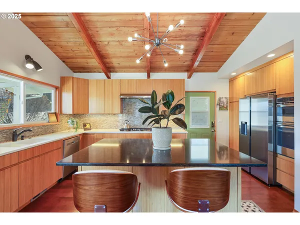 a kitchen with a sink and wooden cabinets