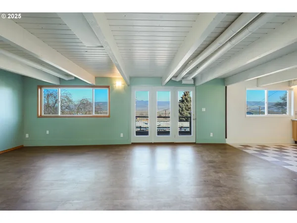 a view of a balcony with furniture
