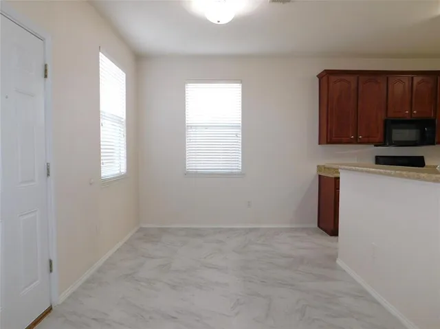 a kitchen with stainless steel appliances granite countertop a refrigerator stove a sink and dishwasher
