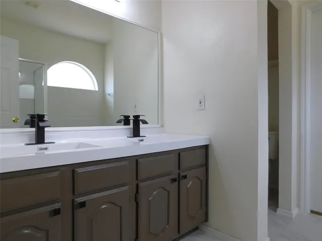 a bathroom with a tub and shower