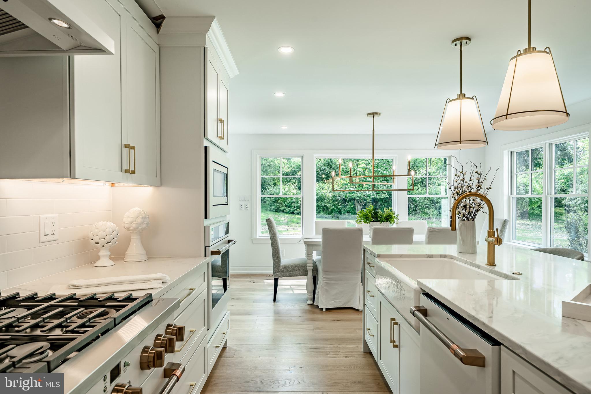 2058 Waterloo Road Berwyn, PA 19312 - Photo 14 of 46 a kitchen with sink a stove and a wooden floor