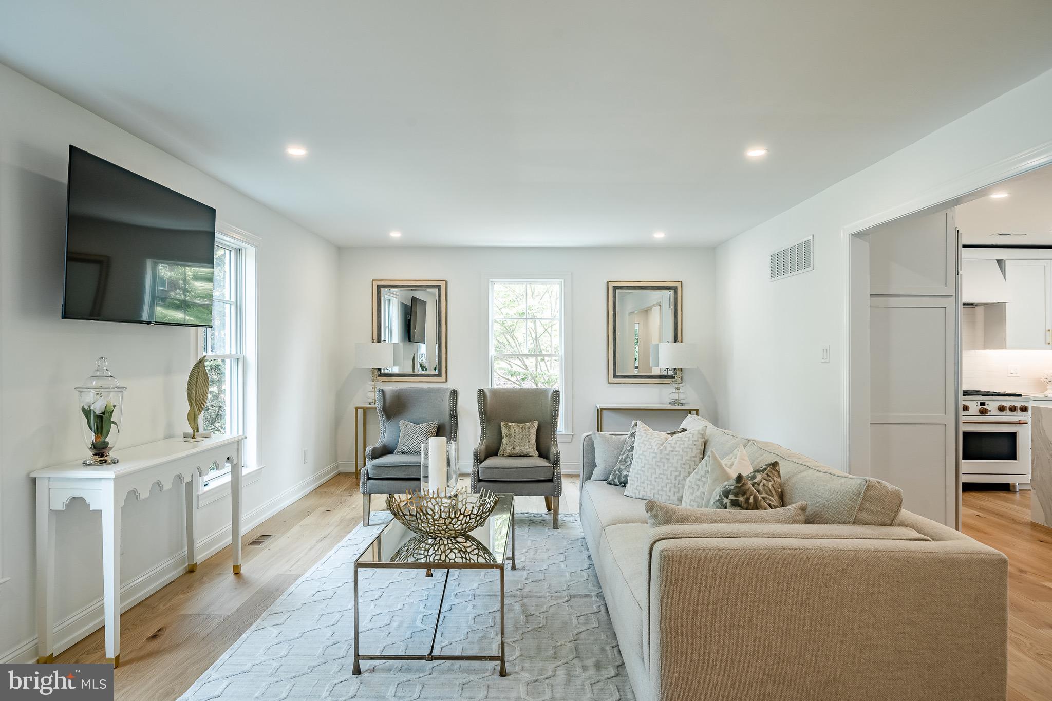2058 Waterloo Road Berwyn, PA 19312 - Photo 17 of 46 a living room with furniture a flat screen tv and a window