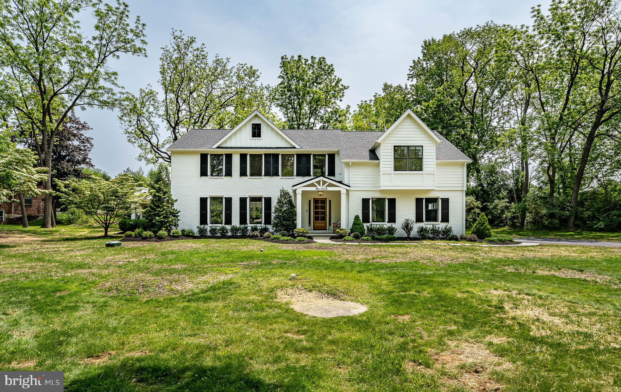 2058 Waterloo Road Berwyn, PA 19312 - Photo 2 of 46 a front view of a house with a garden
