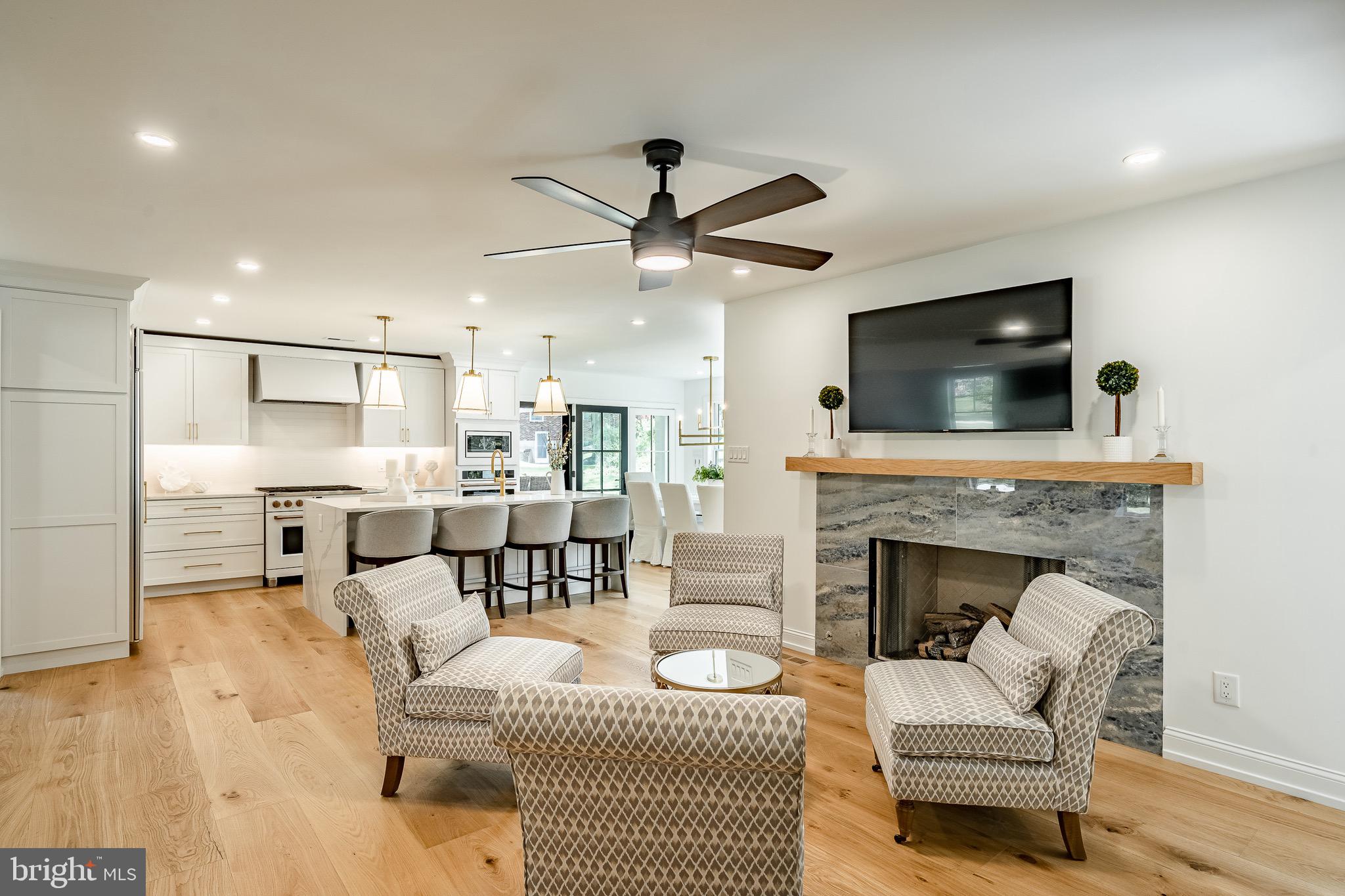 2058 Waterloo Road Berwyn, PA 19312 - Photo 21 of 46 a living room with furniture a fireplace and a flat screen tv