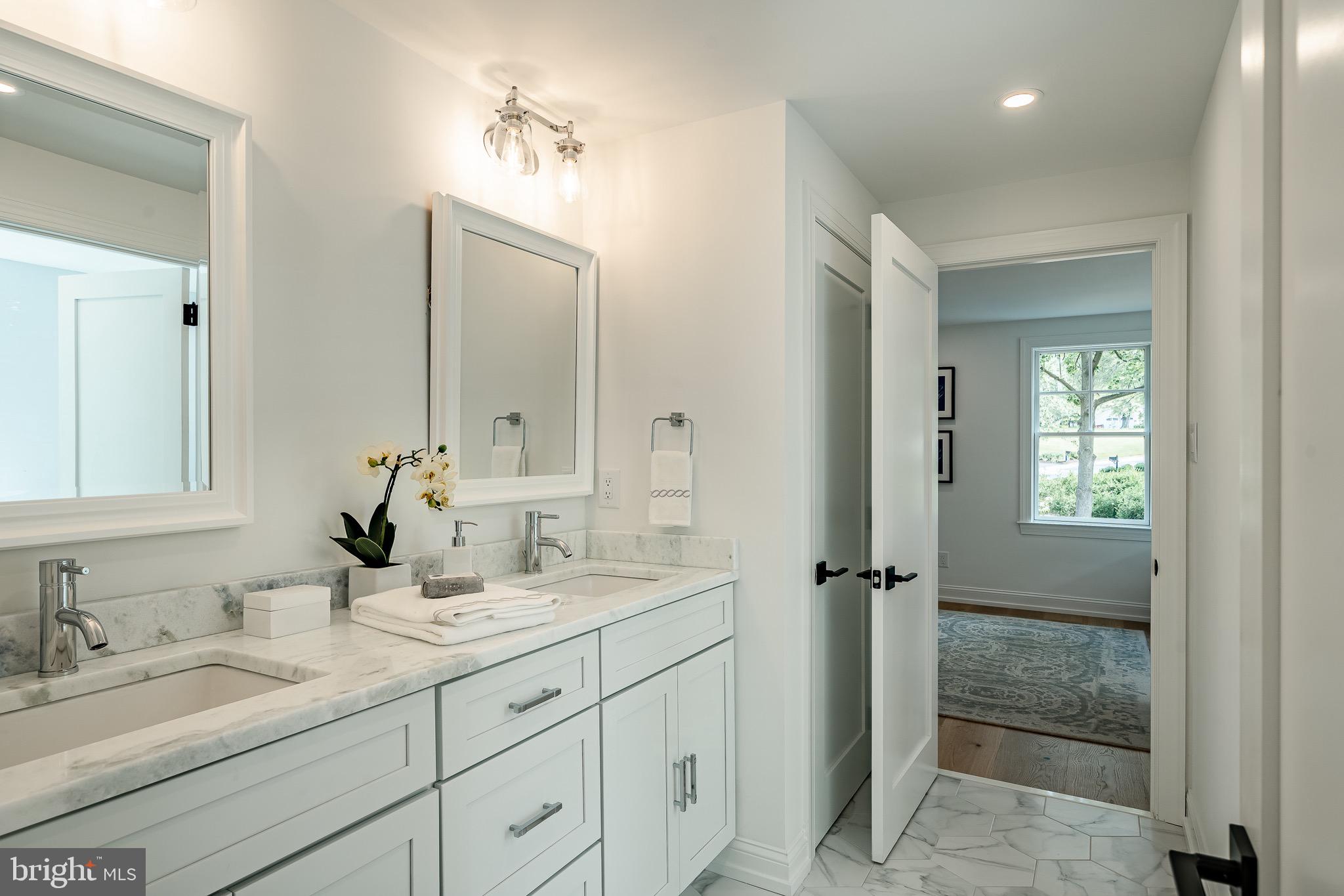 2058 Waterloo Road Berwyn, PA 19312 - Photo 26 of 46 a bathroom with double sink and a mirror