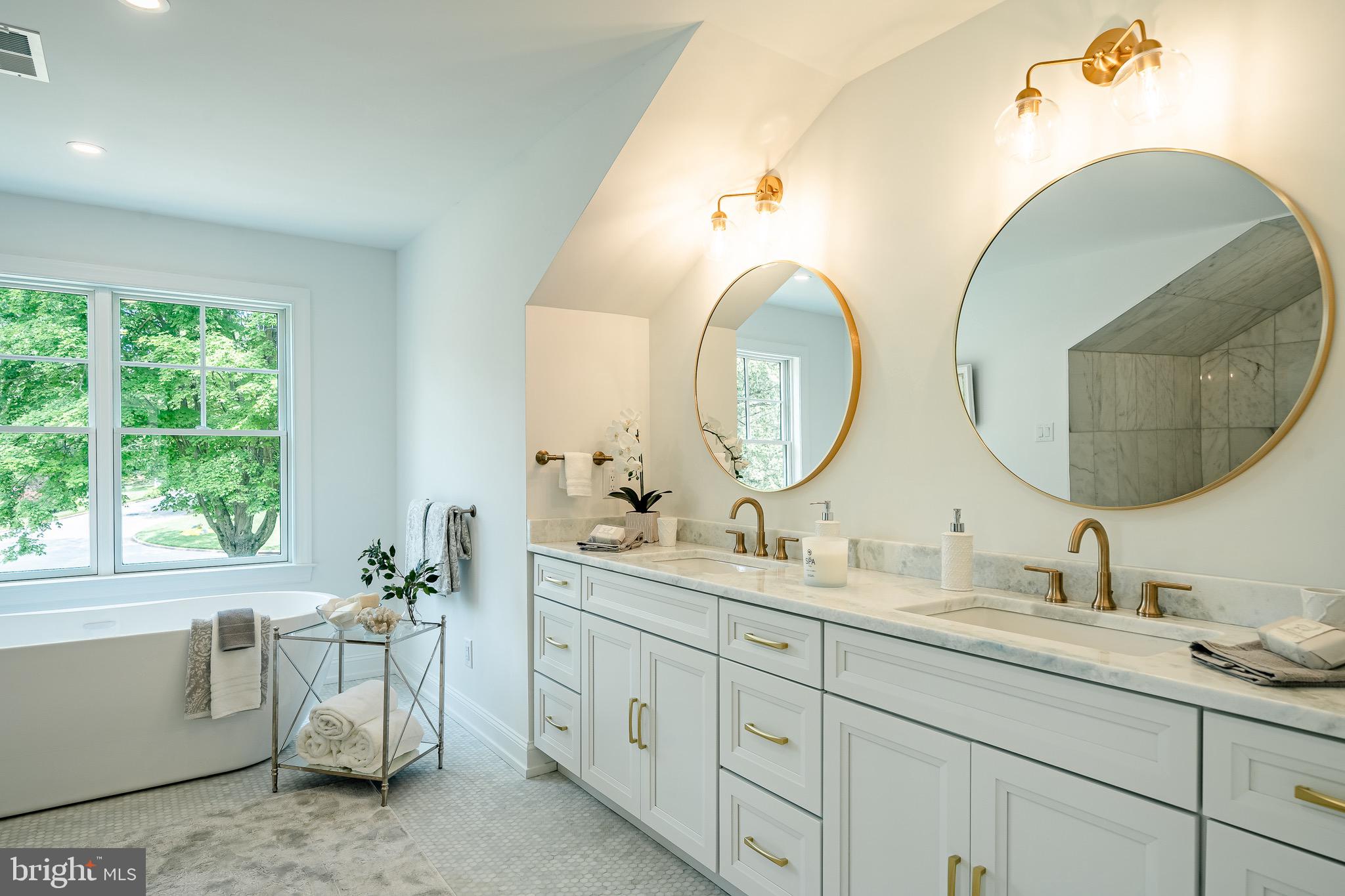2058 Waterloo Road Berwyn, PA 19312 - Photo 37 of 46 a bathroom with a double vanity sink and a mirror