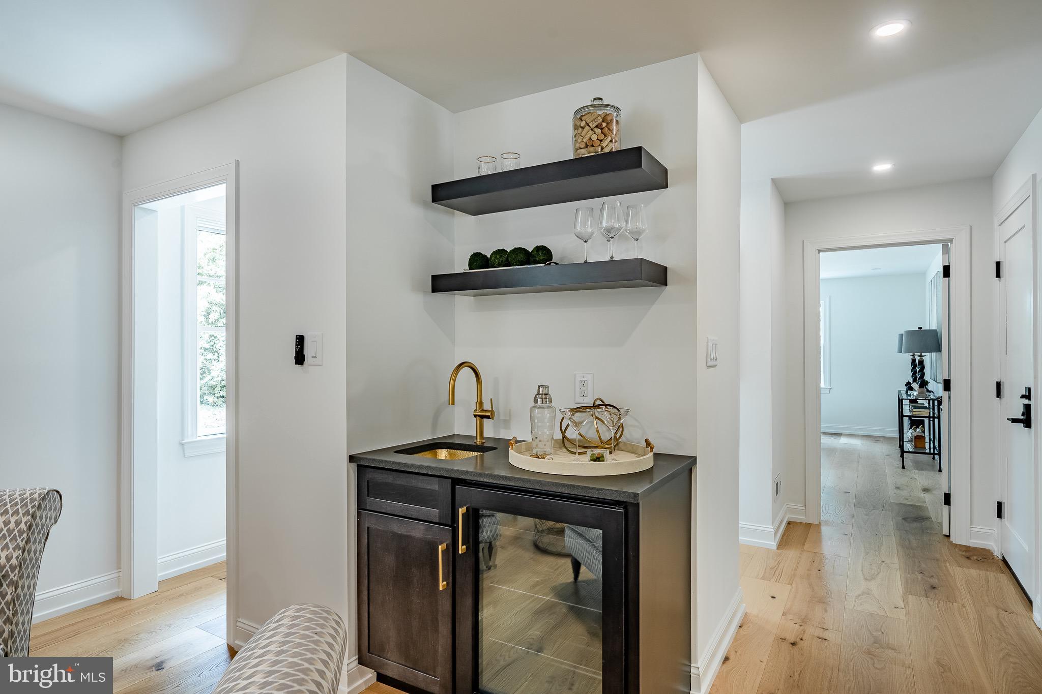 2058 Waterloo Road Berwyn, PA 19312 - Photo 8 of 46 a kitchen with stainless steel appliances a stove a chimney and cabinets