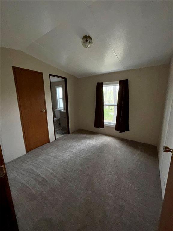 507 Reed Lane Butler, PA 16001 - Photo 18 of 21 a view of a livingroom with an empty space and windows