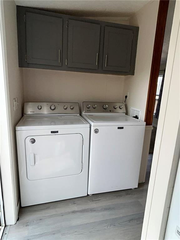 507 Reed Lane Butler, PA 16001 - Photo 20 of 21 a utility room with wooden floor washer and dryer