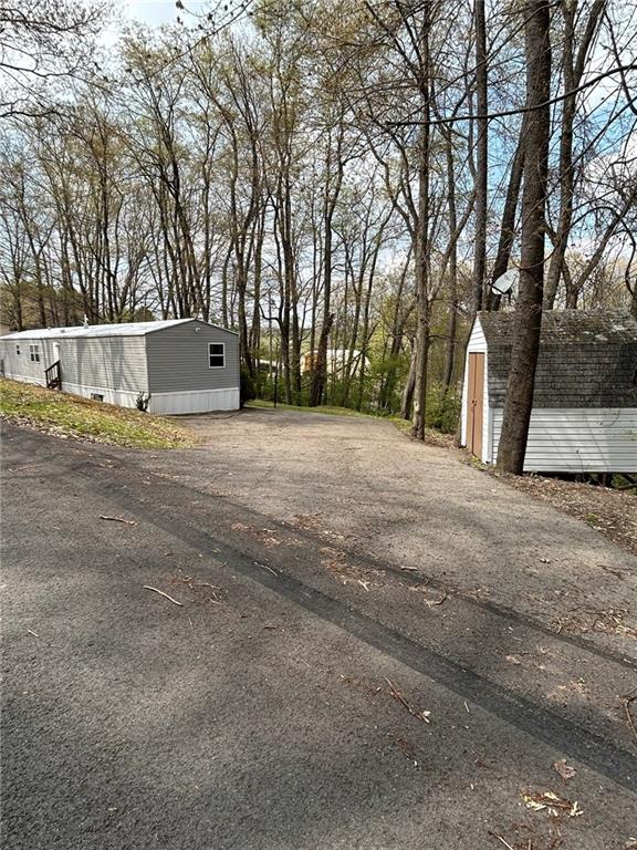 507 Reed Lane Butler, PA 16001 - Photo 2 of 21 a front view of a house with a yard and tree s