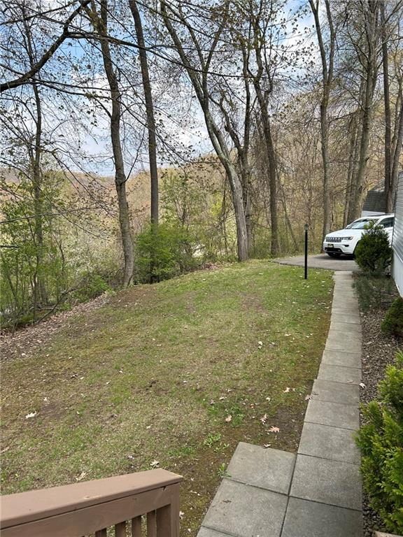 507 Reed Lane Butler, PA 16001 - Photo 5 of 21 a backyard of apartments with large trees