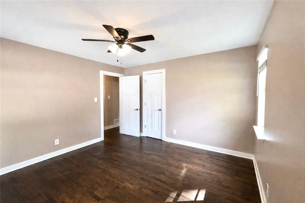 1291 Lorenzo Drive Southwest Atlanta, GA 30310 - Photo 16 of 20 a view of an empty room with wooden floor