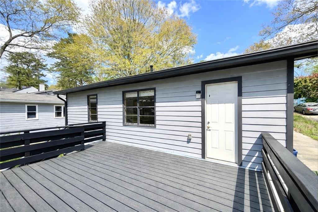 1291 Lorenzo Drive Southwest Atlanta, GA 30310 - Photo 20 of 20 a view of a house with a roof deck