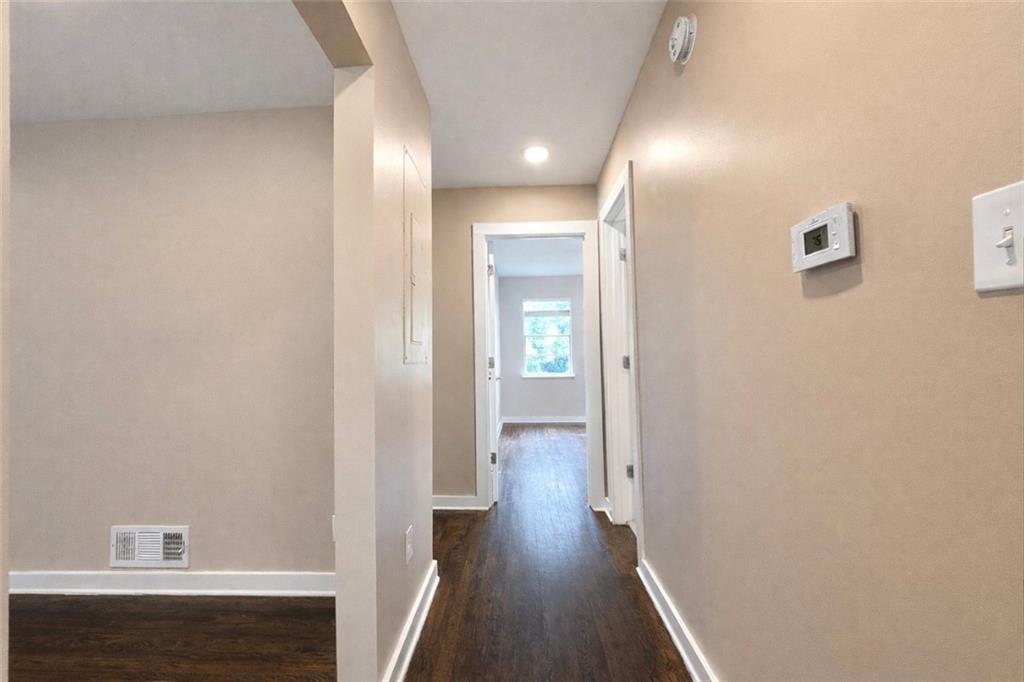 1291 Lorenzo Drive Southwest Atlanta, GA 30310 - Photo 9 of 20 a view of a hallway with wooden floor