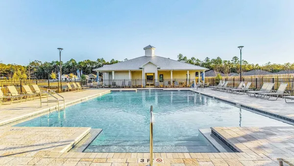 a view of a swimming pool with a patio