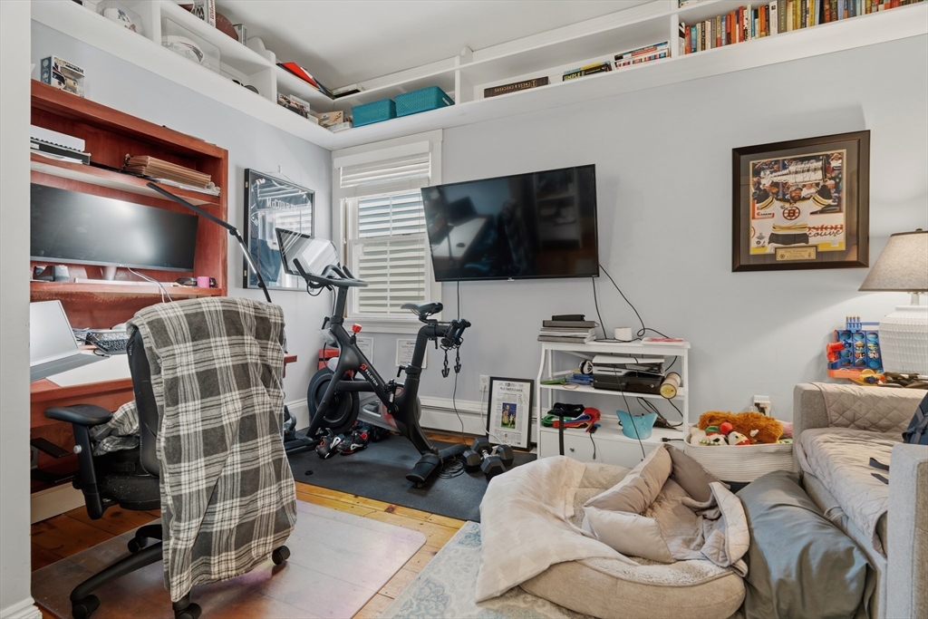 33 Mystic Street, Unit 3 Boston, MA 02129 - Photo 13 of 21 a living room with furniture and a flat screen tv