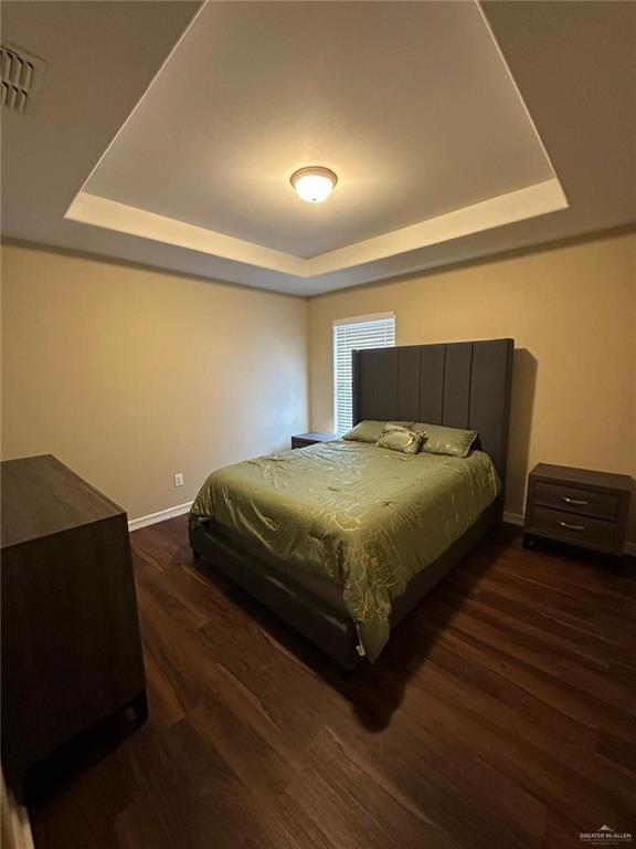 4608 Robin Avenue McAllen, TX 78504 - Photo 9 of 12 Tray ceiling with recessed lighting and central flush-mount fixture